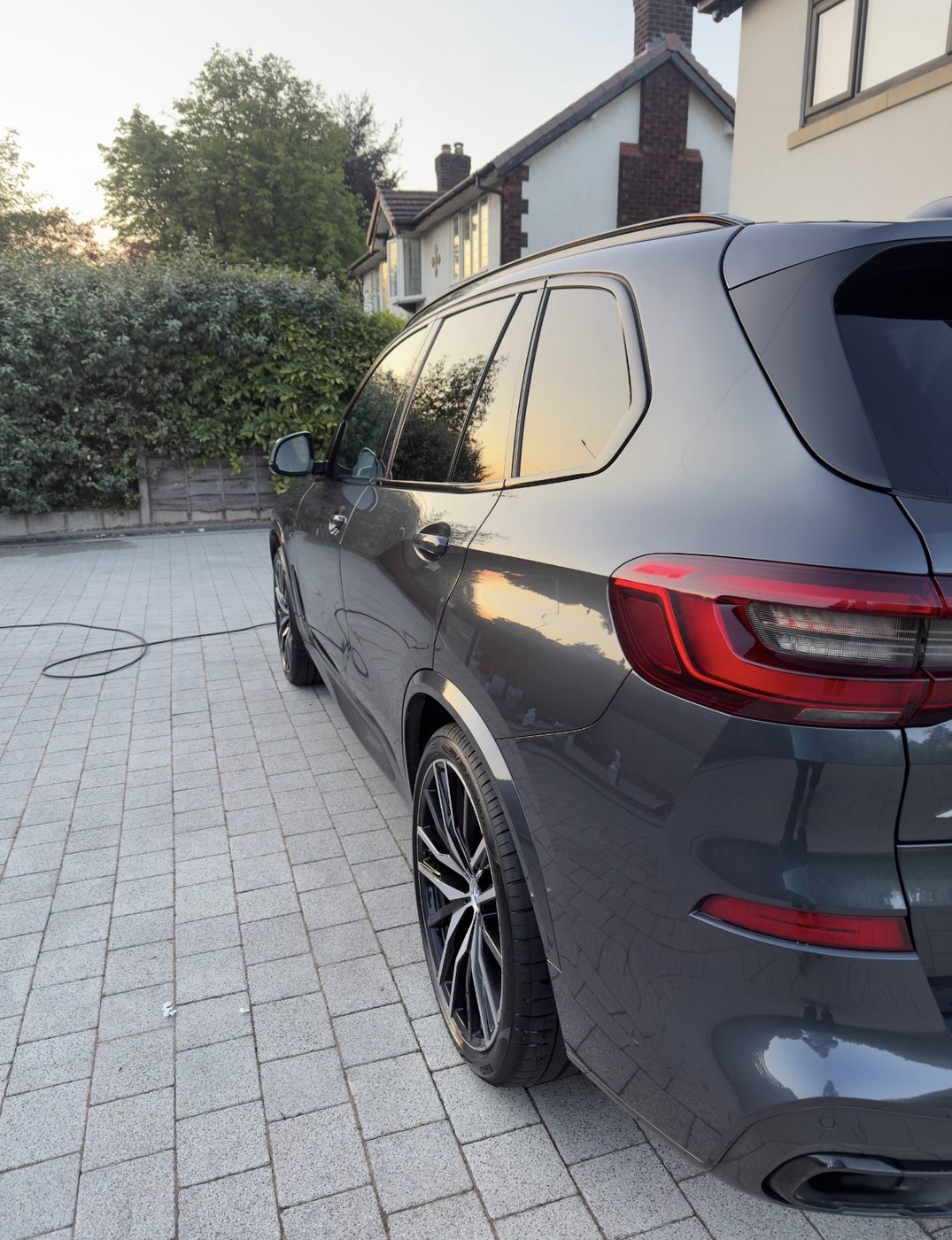 BMW X5 detailed on driveway